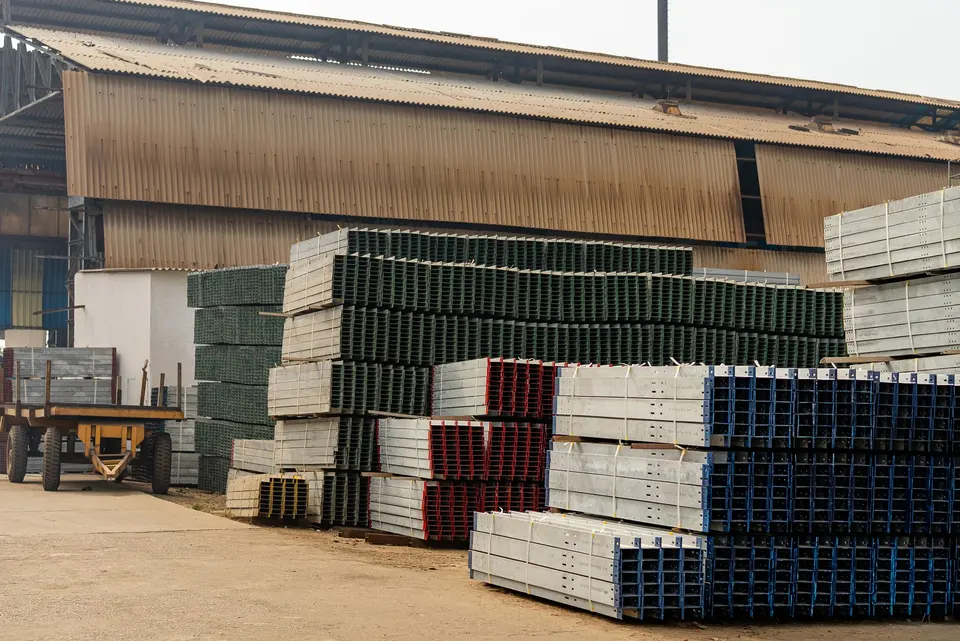 Stacked building materials organized on warehouse shelving